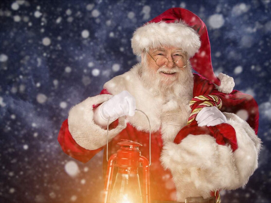 Pictures of Vintage Real Santa Claus carrying gift sack