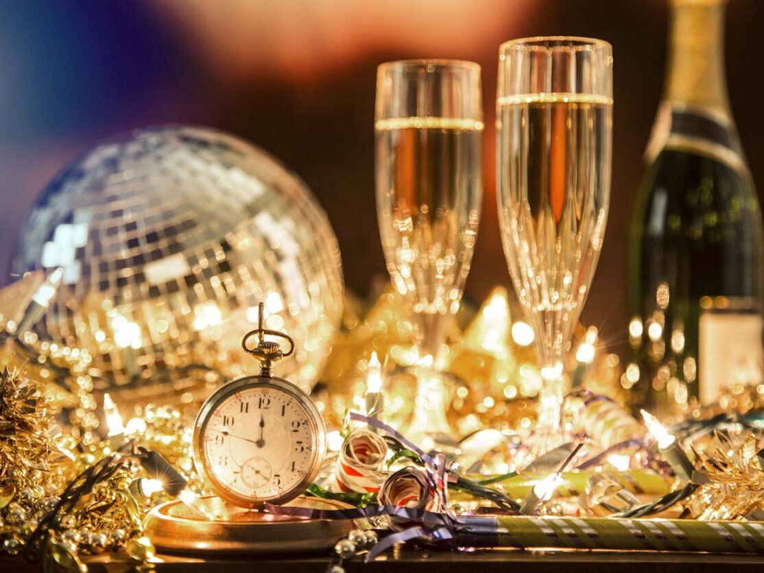 New Year's Eve holiday party, pocket watch, clock at midnight.